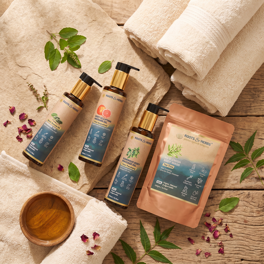 Roots & Herbs Body Massage Spa Kit - lifestyle flat-lay of all four products